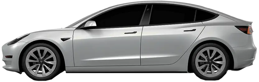 Side view of a silver Tesla with 5% window tint showing extremely dark rear windows.