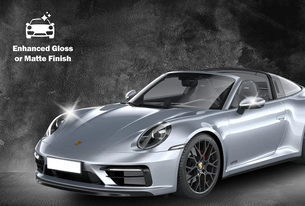 Silver Porsche sports car with a sleek finish, displayed against a textured background showcasing gloss and matte contrast.